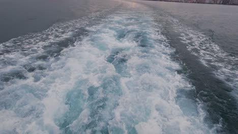 White-Foaming-Sea-Water-Comming-Out-From-Ferry-Boat-Jet-Powered-Engine-Santander-bay-view-from-a-ferry-boat-during-sunset-cloudy-summer-day-1