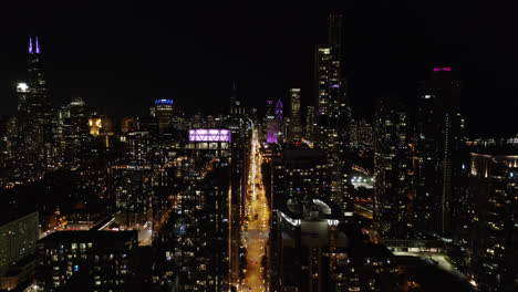 High-Aerial-Flight-Above-Chicago-Skyscrapers-at-Night