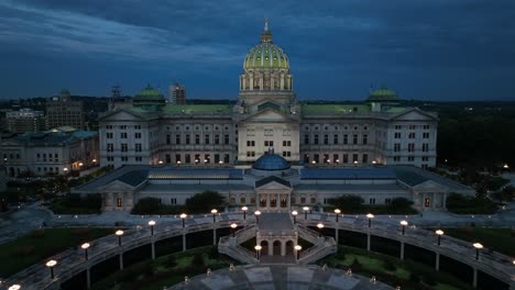 Night-aerial-of-PA-state-capitol-dome-and-capital-complex-in-Harrisburg-Pennsylvania