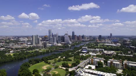 Aerial-view-overlooking-the-Bouldin-Creek-district-and-the-cityscape-of-Austin,-USA---tracking,-drone-shot