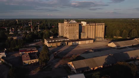 Rising-Arial-cinematic-drone-shot-of-Grain-silo-from-Soviet-Union-Era