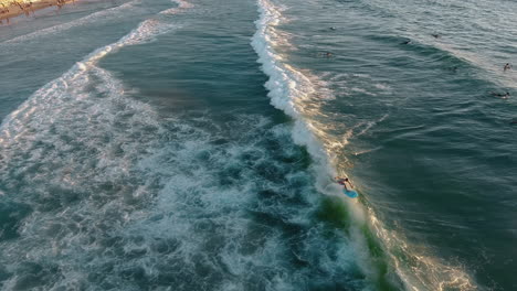 Drone-shot-of-surfers-in-Tel-Aviv
