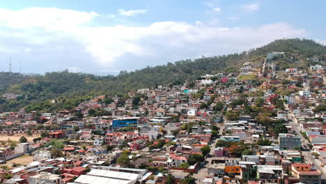 Aerial-landscape-of-typical-residential-neighborhood-in-Oaxaca-City,-Mexico-with-traditional-Mexican-colorful-houses