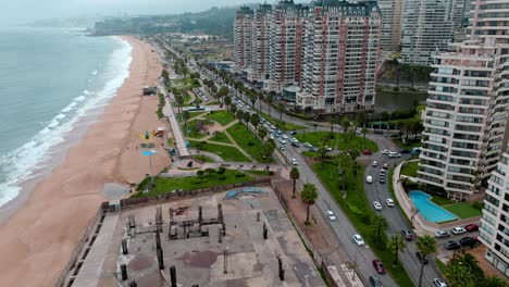 Aerial-view-dolly-in-of-an-abandoned-construction-site-on-the-beach-in-ViÃ±a-del-Mar,-Chile