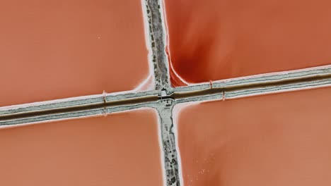 Aerial-view-above-red-Salt-production-pools-in-Albania---screwdriver,-drone-shot