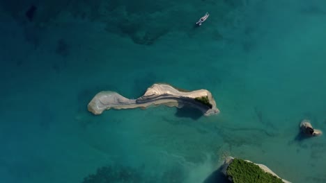 Drone-rotation-top-down-view-of-corfu-islet-island-Greece-summer-holiday-travel-destination