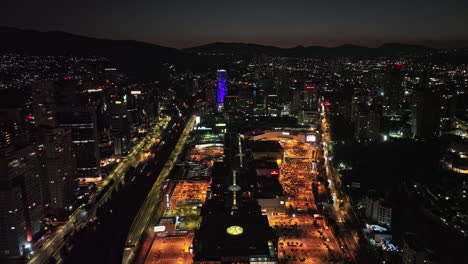 Mexico-City-Aerial-v52-establishing-shot-drone-flyover-santa-fe-shopping-mall,-capturing-night-cityscape-with-illuminated-street-and-traffic-trails---Shot-with-Mavic-3-Cine---January-2022