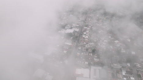 Aerial-footage-above-the-clouds-in-the-outskirts-of-Guatemala-City,-Guatemala