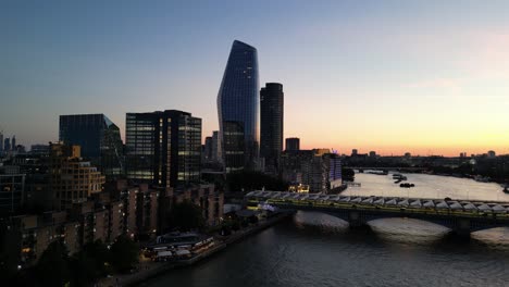 Sunset-over-City-of-London-drone-aerial-view,-Southwark-Bridge-drone-aerial-view