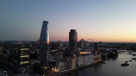 Rising-crane-shot-over-city-of-London-sunset-drone-aerial-view