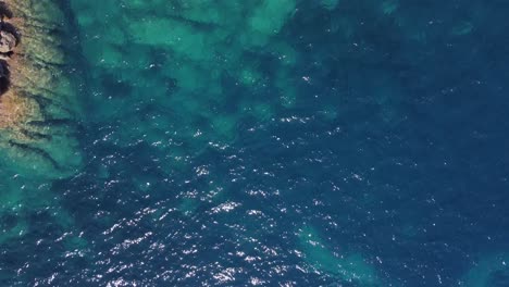 People-on-cliff,-long-shadow
Fantastic-aerial-view-flight-bird's-eye-view-vertical-9:16-drone-footage
of-cliff-edge-beach-Sa-Figuera-Ibiza-summer