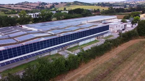 Solar-panels-installed-on-the-walls-and-roof-of-an-industrial-warehouse