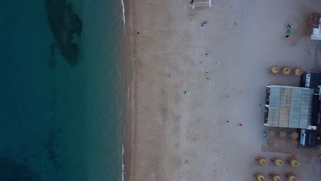 People-on-beach-umbrellas
Amazing-aerial-view-flight-bird's-eye-view-vertical-9:16-drone-footage
at-sunset-golden-houre-evening-in-spain-aro-beach-summer-2022