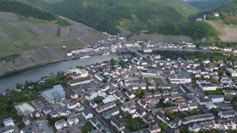 Aerial-flying-over-Bernkastel-Kues-towards-Moselle-River,-Germany