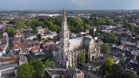 Slow-aerial-circling-Basilica-of-Our-Lady-of-Saint-Cordon,-Valenciennes,-France
