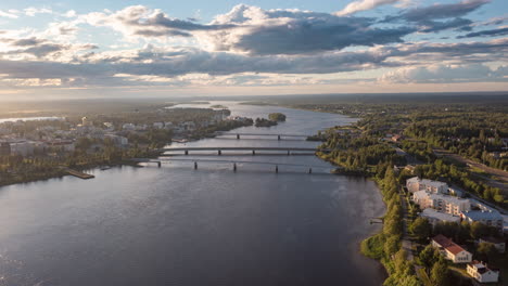 Hyperlapse-of-clouds-moving-over-bridges-and-the-city-of-Tornio,-summer-evening-in-Finland