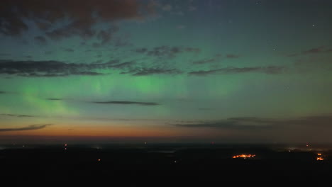 Hyperlapse-drone-shot-of-Aurora-Borealis-and-clouds-moving-over-the-night-sky-in-south-Finland