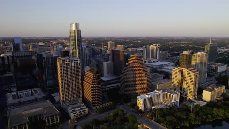 Aerial-view-around-buildings-in-downtown-Austin,-sunset-in-Texas,-USA---circling,-drone-shot