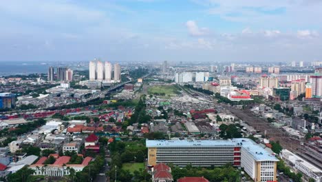Vibrant-aerial-skyline-of-Jakarta-cityscape-and-train-station-on-beautiful-sunny-day