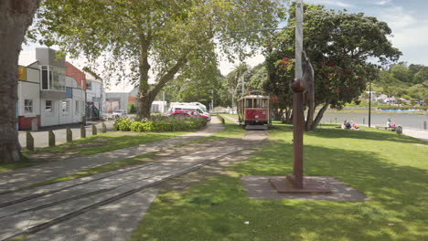 Historic-Tramway-passing-by-in-Wanganui-city,-New-Zealand