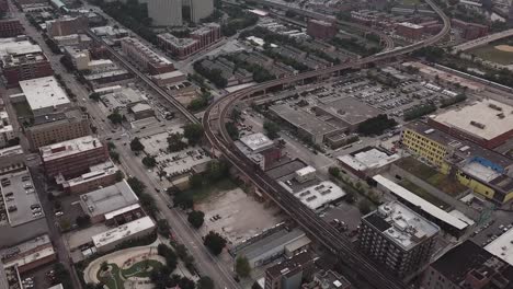 Aerial-footage-of-Chicago's-elevated-train-tracks-and-city-streets