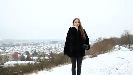 Attractive-young-female-model-posing-in-front-of-a-city-winter-day