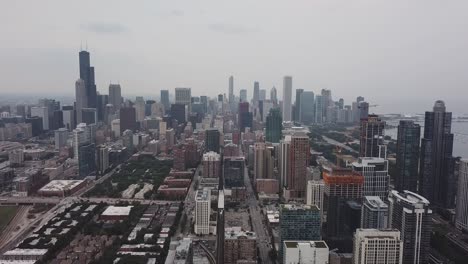 Aerial-footage-Chicago,-Illinois-skyline-next-to-Lake-Michigan