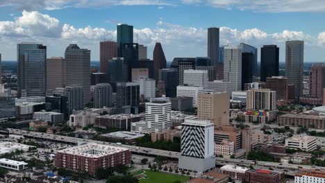 Aerial-view-around-the-high-rise-in-downtown-Houston,-Texas,-USA---circling,-drone-shot