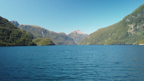 Aerial-over-water-in-New-Zealand-remote-fjord