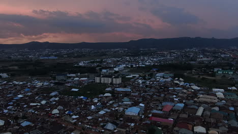 The-developing-Jahi-District-of-Abuja,-Nigeria-at-sunset---aerial-flyover