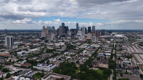 Aerial-view-towards-the-Houston-city-skyline,-in-cloudy-Texas,-USA---approaching,-drone-shot