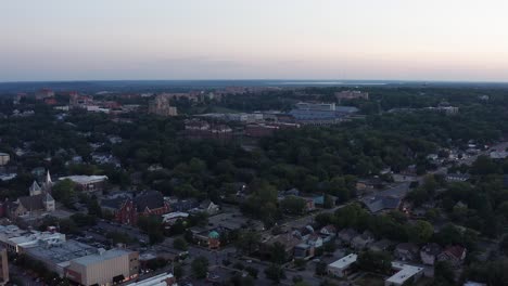 Super-wide-aerial-shot-of-the-University-of-Kansas-campus-in-Lawrence,-Kansas-at-sunset