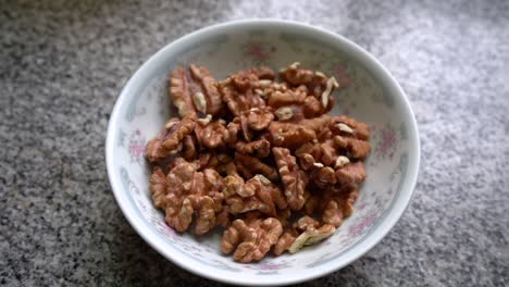 Peeled-Walnuts-In-A-Ceramic-Bowl.---closeup