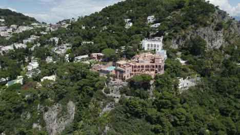 Luxury-Italian-Hotel-on-Cliff-Coastline-of-Capri-Island,-Aerial-Orbit