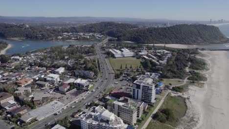 Daytime-Traffic-On-Gold-Coast-Highway-Leading-To-Tallebudgera-Creek-Bridge-With-Burleigh-Head-National-Park-In-View