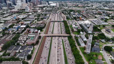 Cars-and-vehicles-driving-on-the-Multilane-highwayÂ´s-of-Houston,-USA---Aerial-view