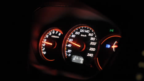 Car-Dashboard-at-night-with-high-beam-on