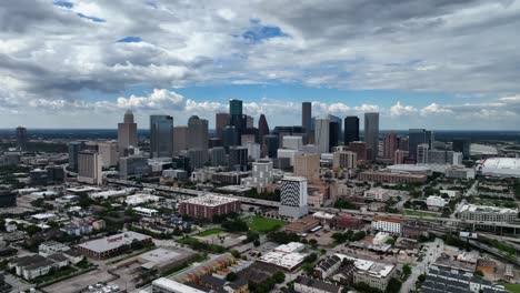 Skyscrapers-in-Houston-Skyline-District-cloudy-TX,-USA---circling,-aerial-view