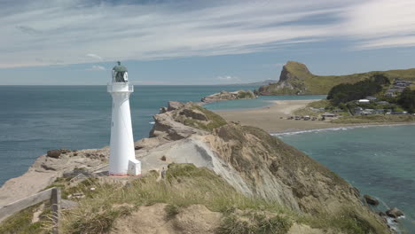 Castlepoint-lighthouse,-beautiful-New-Zealand-coastal-scenery-and-popular-landmark