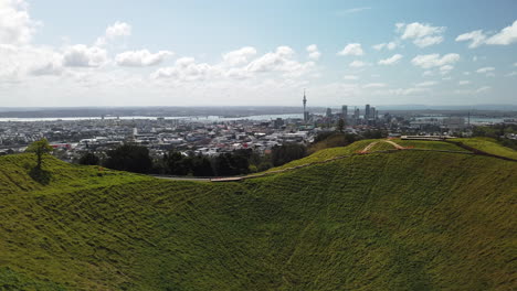 Beautiful-Auckland-cityscape-over-Mount-Eden-volcano-crater,-sunny-day-in-New-Zealand