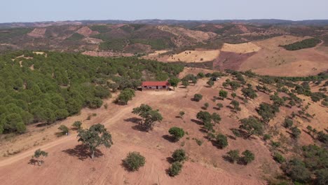 Aerial-orbiting-rural-landscape-in-Alentejo,-Lonely-farmhouse-panoramic-view