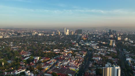 Aerial-Drone-View-of-Urban-Cityscape-of-Mexico-City-at-Sunset,-Establishing-Shot-with-Copy-Space-in-Sky