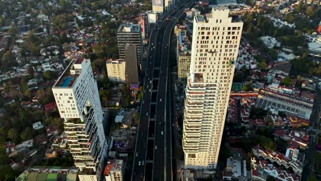 Highway-Interstate-Road-and-Commute-Traffic-in-Downtown-Mexico-City,-Aerial