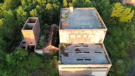 Drone-flying-towards-an-abandoned-coal-mine-in-the-woods