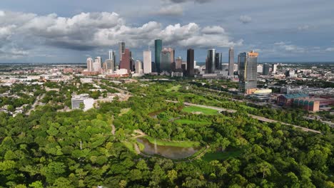 Aerial-view-of-a-park-and-downtown-Houston,-sunny,-afternoon-in-USA---End-screen