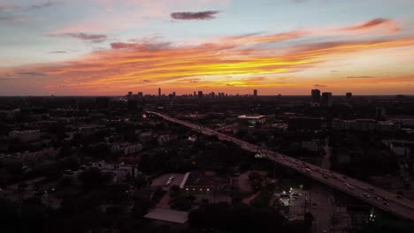 Flying-over-a-neighborhood-in-Houston,-dusk-in-Texas,-USA---rising,-Aerial-view