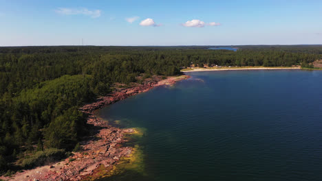 Aerial-view-circling-towards-the-Degersand-beach,-sunny,-summer-day-in-Aland,-Finland