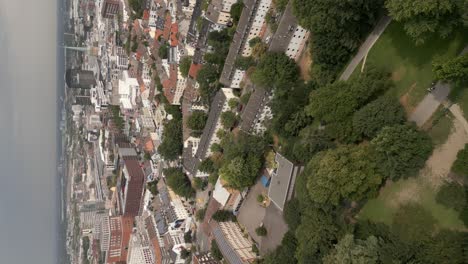 Vertical-drone-shot-of-suburban-German-town-with-residential-homes