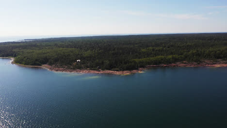 Aerial-view-towards-the-rocky-coast-of-west-Aland,-sunny,-summer-day-in-Finland