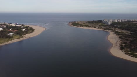 Bird's-eye-view-of-Arroyo-Maldonado-mouth-river-and-riverbanks-in-Uruguay-flowing-into-Atlantic-ocean